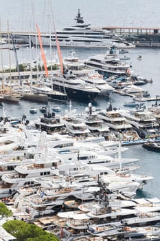 Monaco, Monte Carlo, 27 September 2022 - a lot of luxury yachts at the famous motorboat exhibition in the principality, the most expensive boats for the richest people around the world, yacht brokers. High quality photo