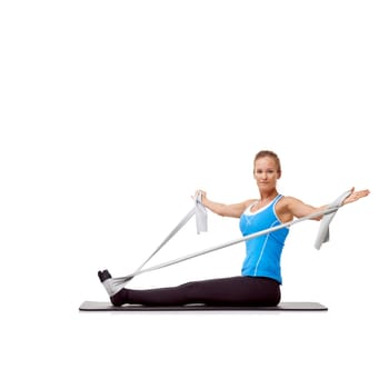Sports, resistance band and portrait of woman doing workout in studio for health, wellness and bodycare. Fitness, yoga mat and person from Canada with arm exercise or training by white background