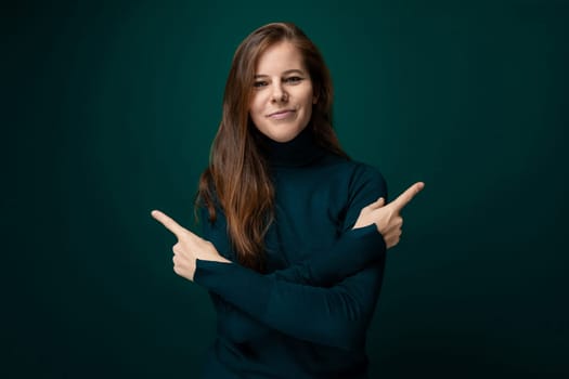 Portrait of a charismatic young woman with brown eyes wearing a green turtleneck.