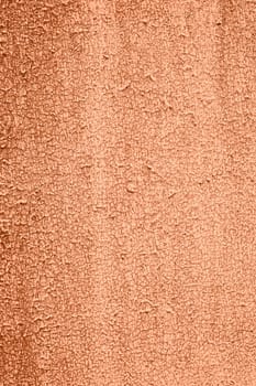 Peach Fuzz toned colour grunge decorative wall background. Art rough stylized texture banner trendy color 2024. Grunge Peach Fuzz color texture. High quality photo