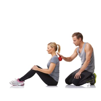 Massage ball, physiotherapist and studio with a woman with sport, fitness and workout back injury. Physical therapy, man and wellness with physio health and helping with white background and support.