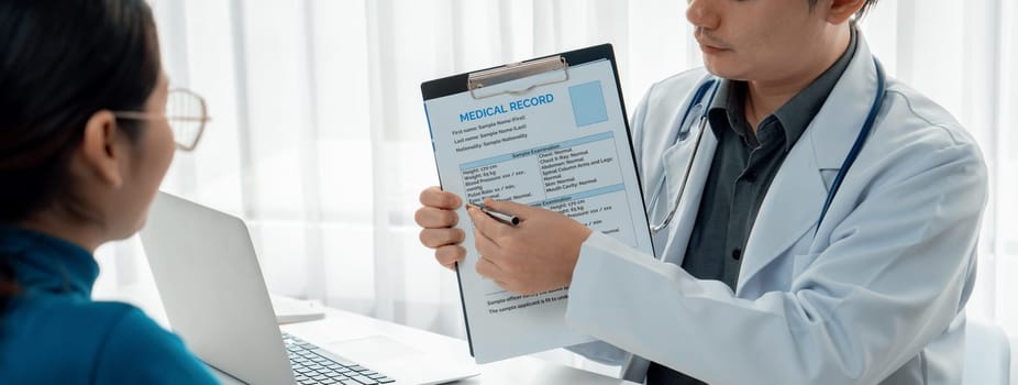 Patient attend doctor's appointment at clinic or hospital office, discussing medical treatment options and explaining examination results or medical record about sickness. Panorama Rigid