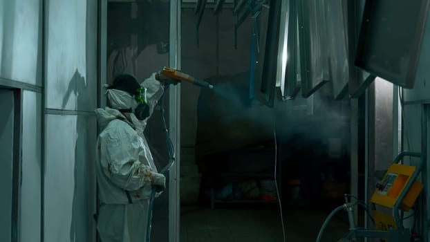Metal powder coating. Creative. Professional hand spray painting of a metal products