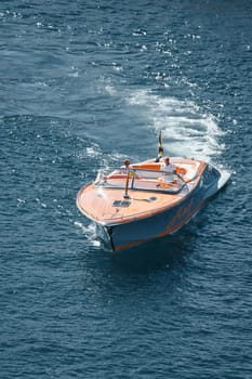 Monaco, Monte Carlo, 28 September 2022 - a boat with guests of yacht brokers departs from the shore in the largest fair exhibition in the world yacht show MYS, port Hercules, rich clients, sunny. High quality photo