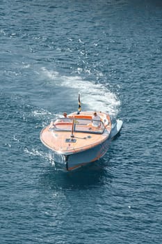 Monaco, Monte Carlo, 28 September 2022 - a boat with guests of yacht brokers departs from the shore in the largest fair exhibition in the world yacht show MYS, port Hercules, rich clients, sunny. High quality photo