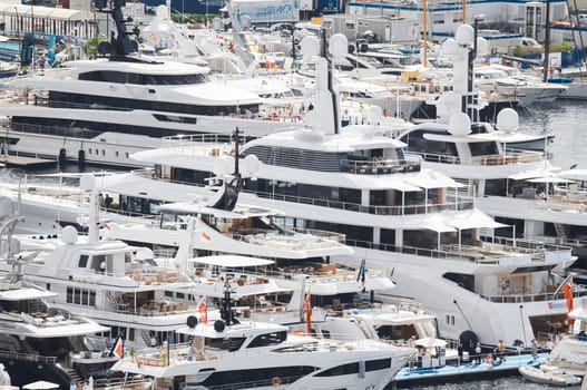 Monaco, Monte Carlo, 28 September 2022 - a lot of luxury yachts at the famous motorboat exhibition in the principality, the most expensive boats for the richest people around the world, yacht brokers. High quality photo