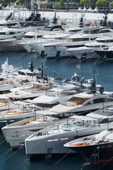 Monaco, Monte Carlo, 28 September 2022 - a lot of luxury yachts at the famous motorboat exhibition in the principality, the most expensive boats for the richest people around the world, yacht brokers. High quality photo