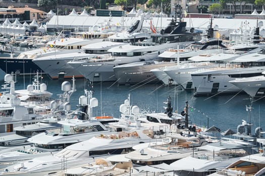 Monaco, Monte Carlo, 28 September 2022 - a lot of luxury yachts at the famous motorboat exhibition in the principality, the most expensive boats for the richest people around the world, yacht brokers. High quality photo