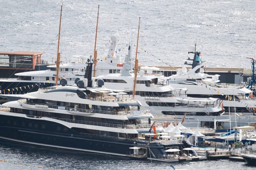 Monaco, Monte Carlo, 28 September 2022 - a lot of luxury yachts at the famous motorboat exhibition in the principality, the most expensive boats for the richest people around the world, yacht brokers. High quality photo