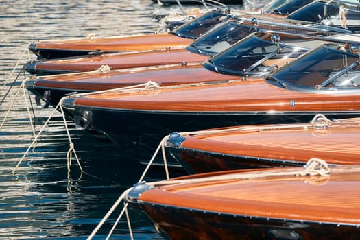 Few luxury retro motor boats in row at the famous motorboat exhibition in the principality of Monaco, Monte Carlo, the most expensive boats for the richest people, boats for rich clients. High quality photo