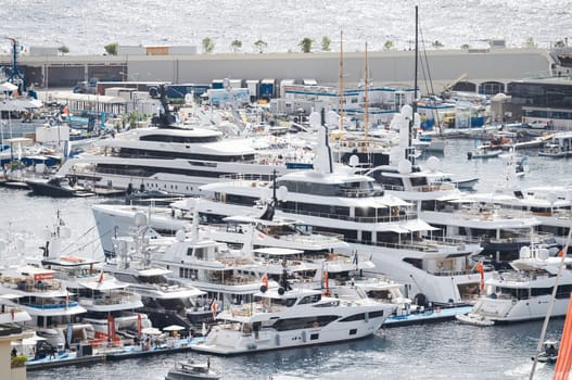 Monaco, Monte Carlo, 28 September 2022 - a lot of luxury yachts at the famous motorboat exhibition in the principality, the most expensive boats for the richest people around the world, yacht brokers. High quality photo