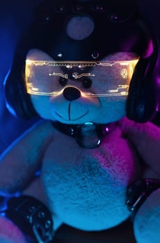 toy bear dressed in leather BDSM belts, headphones and glowing glasses in neon light listens to music. dark background