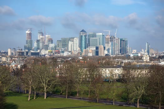 London, United Kingdom - February 02, 2019: Banks and financial companies skyscrapers in Canary Wharf - UK capital financial district, on sunny early spring day, as seen from Greenwich.