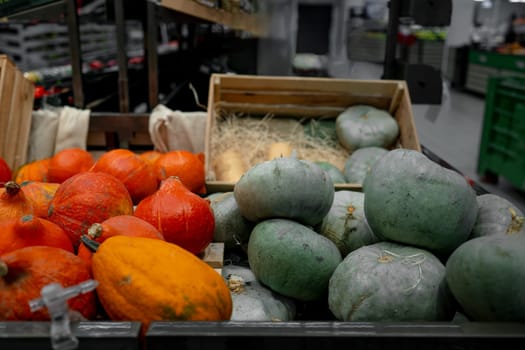 Supermarket Shelves Are Filled With Colorful Pumpkins