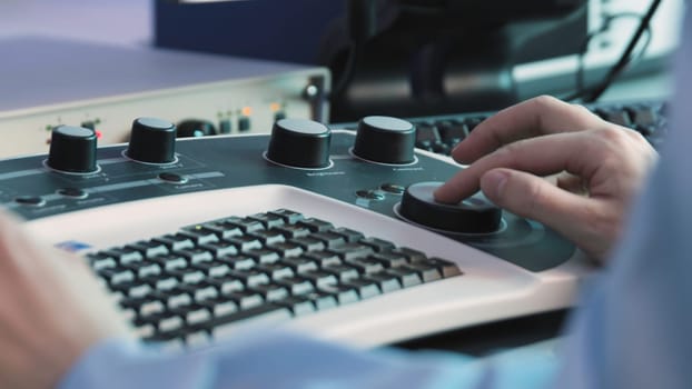 Keyboard with doctor's mouse. Stock footage. Modern medical keyboard with mouse for ultrasound fixation. Viewing with round mouse in medical examination.
