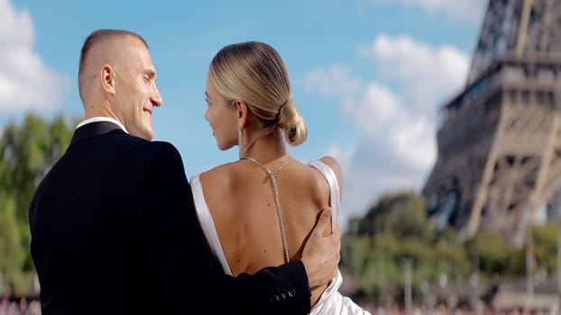 An elegant couple on a journey. Action. A man with his beautiful companion model admiring the view of the Parisian attractions. High quality 4k footage