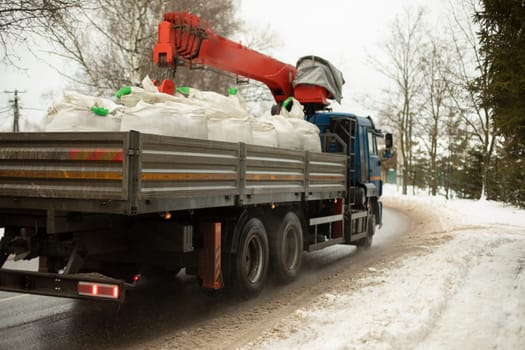 Truck for work. Truck on the street. Cargo transportation in the city. Details of a large car.