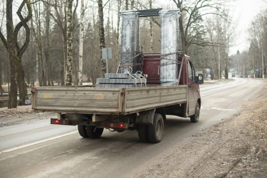 Truck in city. Cargo transport machine. Transport on road. Car with load.