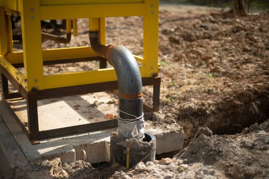 Gas equipment in city. Gas pipe. Technical structure. Yellow paint on building.