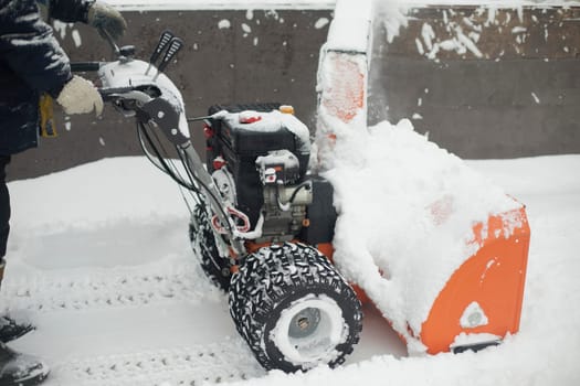 Snow removal equipment at stadium. Ice cleaning. Snow removal for playing hockey. Snow throwing machine.