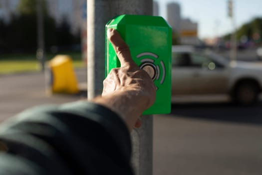 Pedestrian crossing alarm button. Button for road. Clicking on panel. Automatic pedestrian crossing.