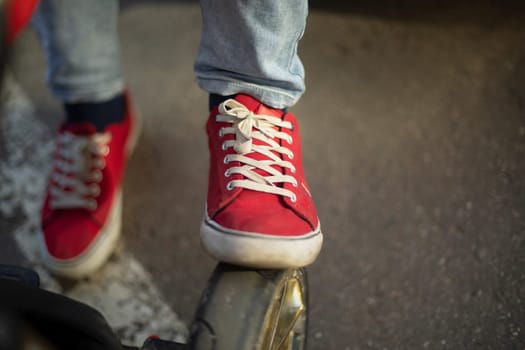 Red sneakers. Old shoes. Punk style. Simple sneakers.