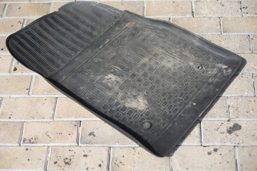 Car foot mat. Rubber mat from car. Cleaning in Transoprt. Shoe Mat Cleaning.