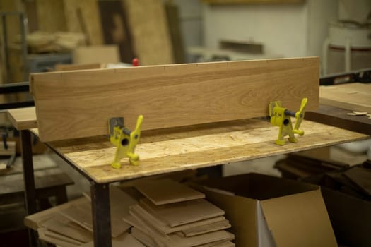 Workbench for boards. Table in carpentry workshop. Carpenter's workplace. Creation of furniture.