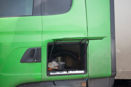 Car repairs. Luggage rack in transport. Truck in detail. Green Color Machine.