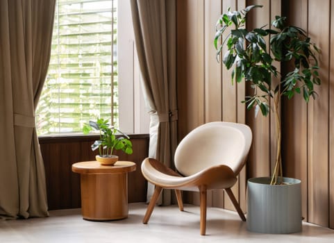 chair and round wooden coffee table against window near paneling wall