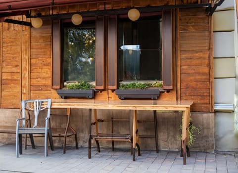 Exterior of small European wooden cafe or restaurant. with copy space.