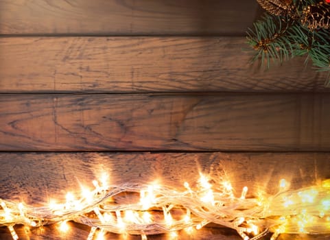 Beautiful christmas light on wooden background