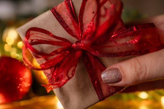 Christmas gift or present box, against magic bokeh background. Beautiful Christmas gift boxes with ribbon.