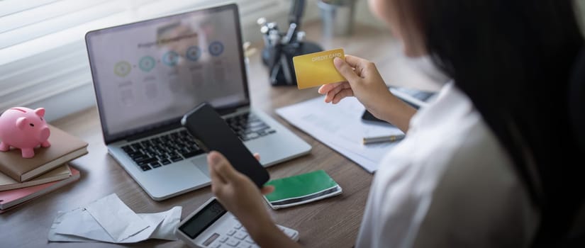 Woman on desk with smartphone, credit card and ecommerce payment for online shopping at home. digital bank app and sale on store website with internet banking.