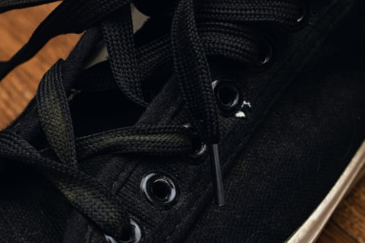 Laces on Black Flap Shoes close up, macro photo
