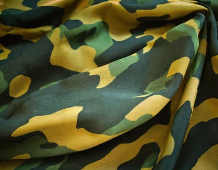 Camouflage texture in a military style on silk fabric. Hight realistics silk.