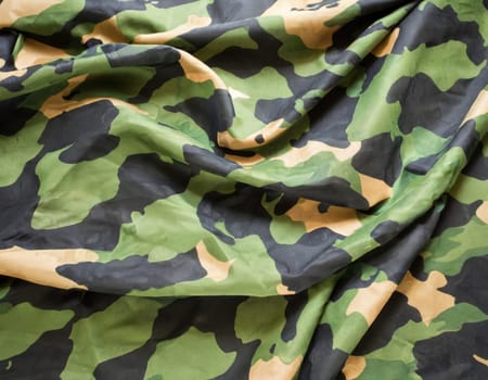 Camouflage texture in a military style on silk fabric. Hight realistics silk.