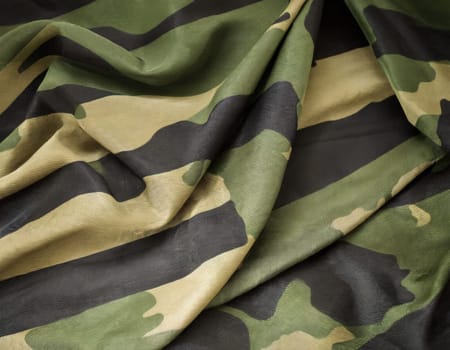 Camouflage texture in a military style on silk fabric. Hight realistics silk.