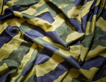 Camouflage texture in a military style on silk fabric. Hight realistics silk.