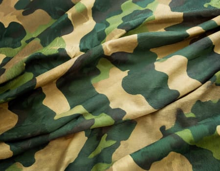 Camouflage texture in a military style on silk fabric. Hight realistics silk.