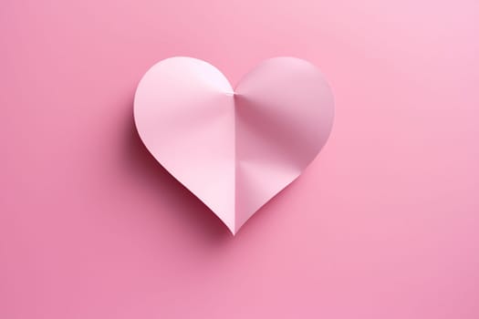 Pink heart in cut paper style on pink background. Concept of love, congratulations.
