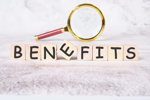 BENEFITS a word written on wooden cubes