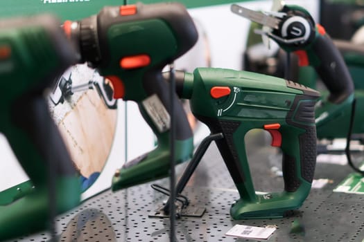 Power tools, drills and hammers of various manufacturers are sold in hardware store.