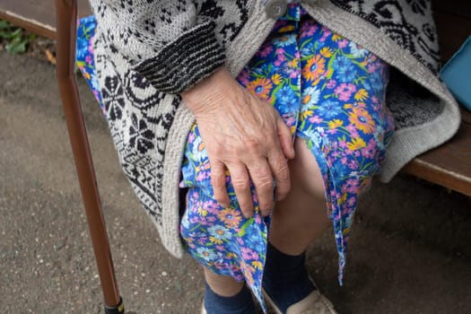 Hand of old man. Pensioner in Russia. Hand on knee. Old palm.