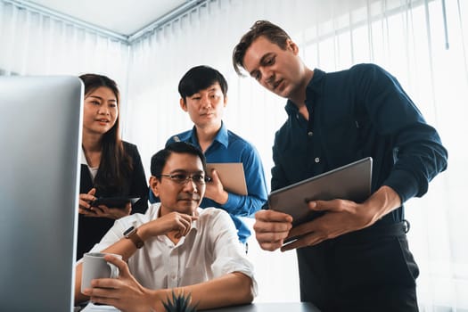 Group of diverse office worker employee working together on strategic business marketing planning in corporate office room. Positive teamwork in business workplace concept. Prudent