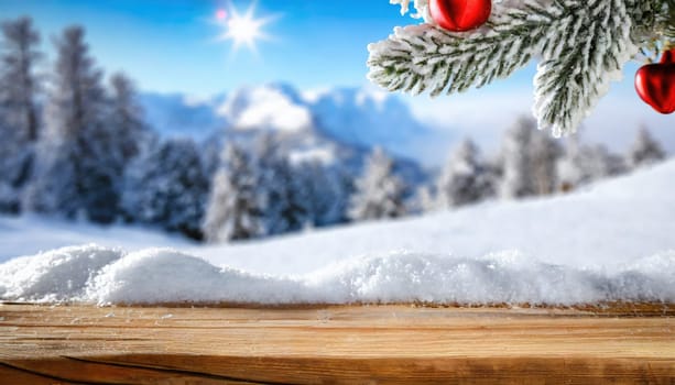 Wooden desk cover of snow and frost with christmas tree branch decoration.