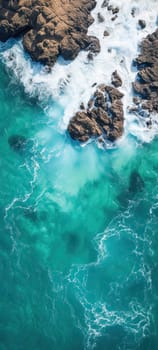 Aerial view of the ocean with rocks of a tropical coast with copy space.