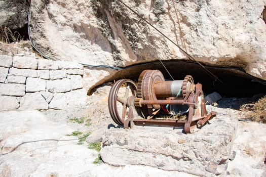 Mechanism in old mine. Engine for ore lifting. Coal mine is in detail.