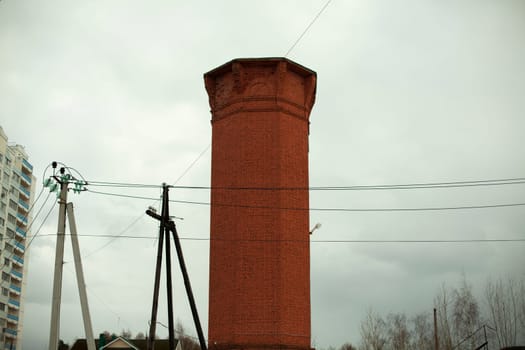 The old brick tower. Brick structure of the last century. Architecture of the 18th century.