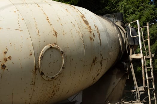 White rusty tank. Transportation of fuel. Old truck. Steel tank.